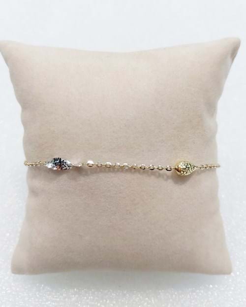 Bracciale in oro bianco e giallo con ghiande