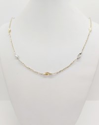 Collana girocollo in oro bianco e giallo.