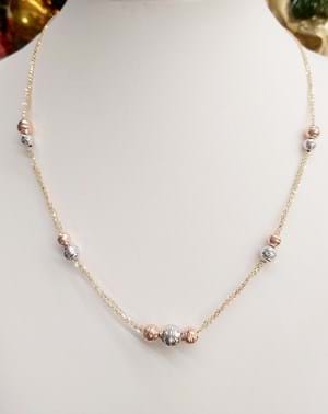 Collana girocollo in oro giallo con sfere in oro bianco e rosa